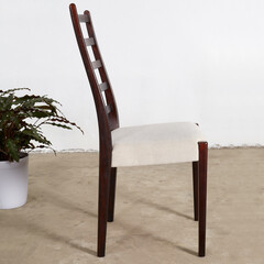 Elegant Mid-Century Modern rosewood dining chair. Vintage dark wood ladderback chair. Interior...