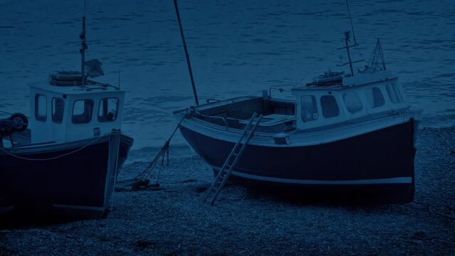 Fishing Boats On The Beach In The Evening