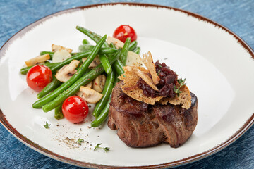 grilled steak with vegetables and sauce