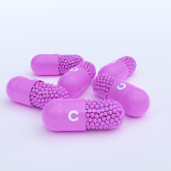 Vitamin C With Pink Capsules, Granules and White Background