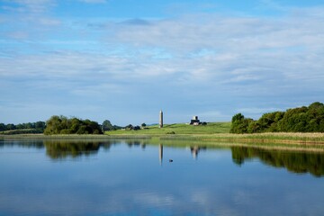 Obraz premium Monastic Site In Distance; Devenish Island, County Fermanagh, Northern Ireland