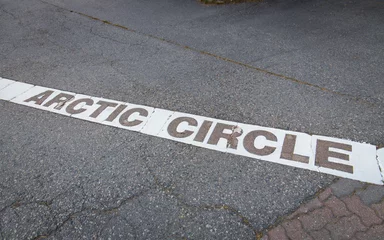 Fotobehang Arctic circle marking line at the floor in Rovaniemi, Finland © Photofex
