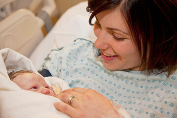 Mother Holding Newborn Baby Daughter; Edmonton, Alberta, Canada