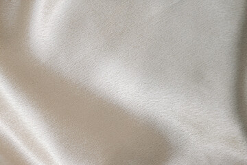 Fototapeta premium Silvery smooth silk texture of beauty silk