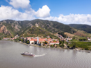 Panorama of Wachau valley (Unesco world heritage site) with ship on Danube river against Duernstein village in Lower Austria, Austria - 649886348