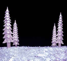 Christmas New Year background. Silver lilac sparkling Christmas trees. Lots of free space for your...