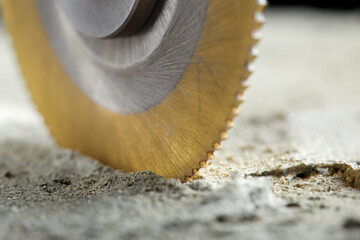 Metal saw, end mill or drill bit with diamond coating makes hole in concrete slab. Industry and...