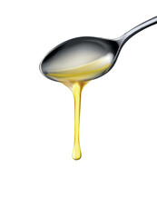 Organic olive oil poured from spoon