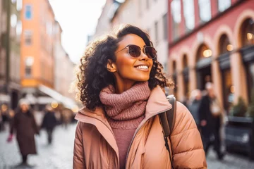 Photo sur Plexiglas Stockholm Multiethnic woman traveling in Stockholm. Happy young traveler exploring in city.