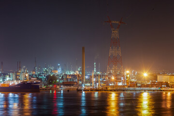 PORT-JEROME, FRANCE: night view of a petrochemical plant on the banks of the Seine River