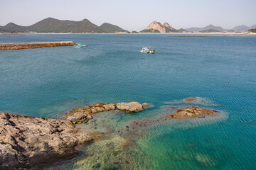 Seonyudo Island with fishing boats in Jeongjado bay, beautiful transparent and turquoise sea water, South Korea