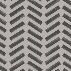 Herringbone seamless pattern with ink brush strokes. Grunge textured lines background