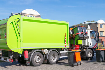 City garbage truck with robotic arm in the street. © Jan van der Wolf
