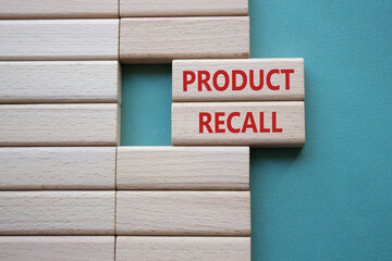 Product recall symbol. Concept words Product recall on wooden blocks. Beautiful grey green...