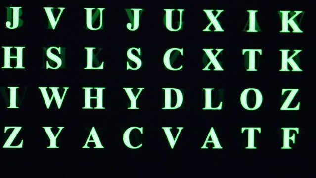 GREEN random Uppercase Characters on black background of PC monitor