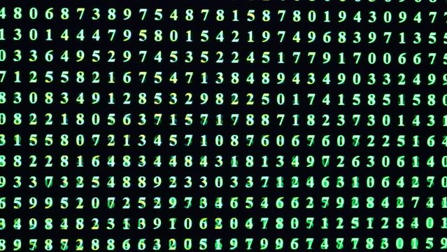 GREEN random numbers on black background of personal computer screen