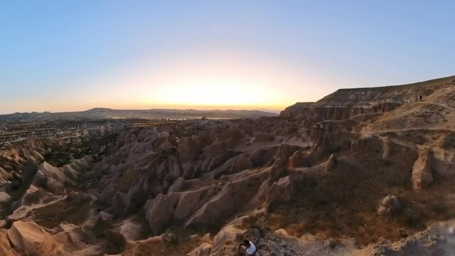 The tranquil atmosphere, coupled with the vibrant colors of the evening sky, makes the sunset a truly enchanting and unforgettable experience in the heart of Cappadocia in Turkey