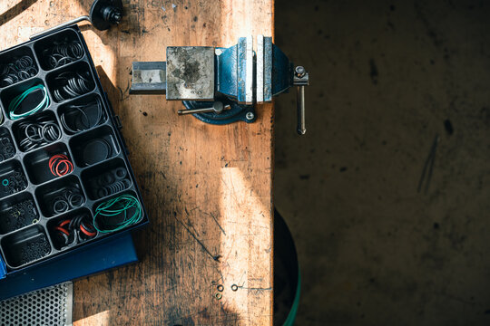 mood shot of authentic workbench with vise in workshop in top view