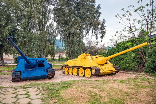 Two tanks painted in the colors of the Ukrainian flag.