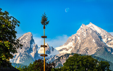 typical bavarian maypole in front of blue sky