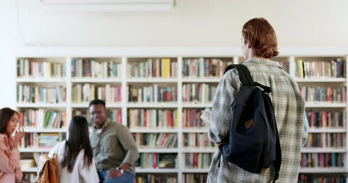 People, students walking or man in library for education, knowledge or study group for college project. Learning, fist bump or start of conversation with studying talk or teamwork in school meeting