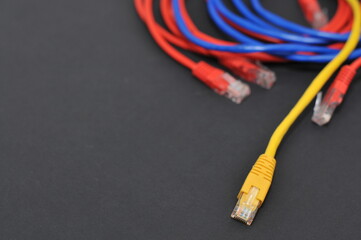 Network internet cable isolated on black background