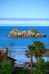 Vacation on Green coast of Asturias, views of Celorio village with sandy beaches, North of Spain