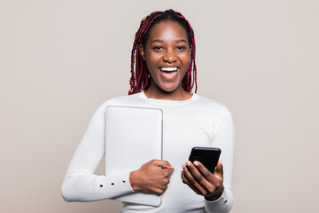 Happy African American girl lady milenial woman with cellphone in hands laptop ready to go to...