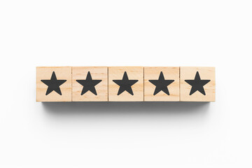 5 Stars wooden cubes on grey background