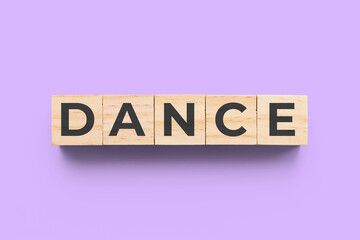 Dance wooden cubes on purple background