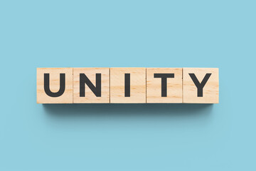 Unity wooden cubes on blue background