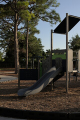 Slider in the playground in Naples Florida, no kids, at sunset, hot day.