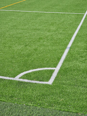 Close-up of lines painted on a school football pitch with artificial grass, Łódź, Poland