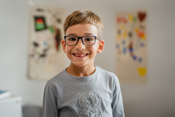 One schoolboy with eyeglasses at home portrait