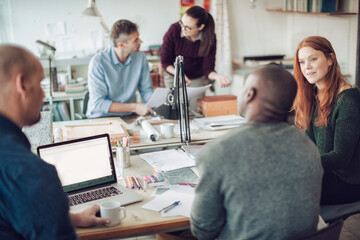 Obraz premium Diverse group of architects working on a project together in a modern company office