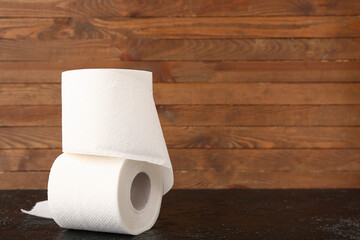 Rolls of toilet paper on black table