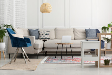 Stylish living room with beautiful carpet and modern furniture. Interior design