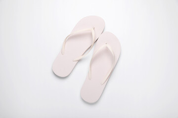 Stylish flip flops on white background, top view