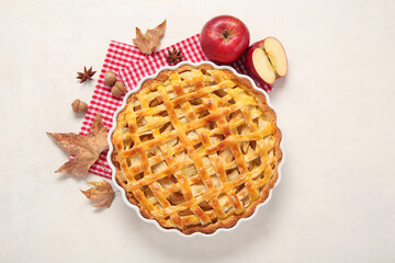 Baking dish with delicious apple pie on white background
