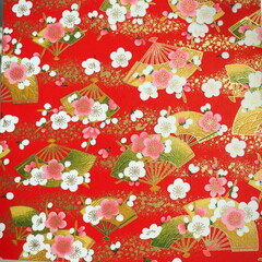 Japanese traditional patterns with the  festive theme  (gold fans and plum flowers) in the red background