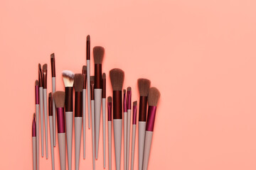Makeup brushes on red background