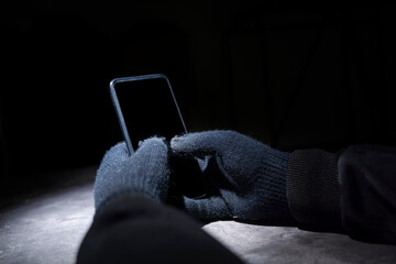 Hacker hand hacking mobile phone security