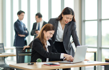 Asian professional successful female businesswoman supervisor mentor in formal suit standing...