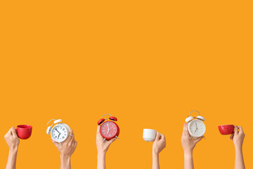 Hands holding different alarm clocks and cups on yellow background
