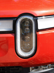 Modern electro car headlight close-up.