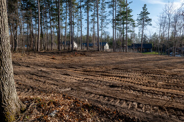 Empty building lot, with soil leveled and prepared for the future construction of a new home, in a lovely neighborhood.
