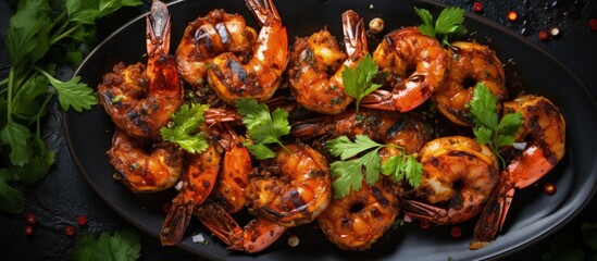 Top view of tiger prawns and shrimp skewers fried on a stone background