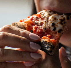 woman eating a pizza 