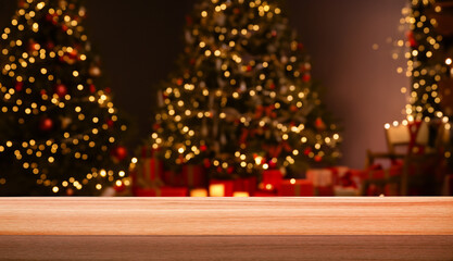 Empty table in front of Christmas tree with decorations background. For product display montage