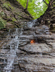 The Eternal Flame in New York. A flame under a waterfall.
